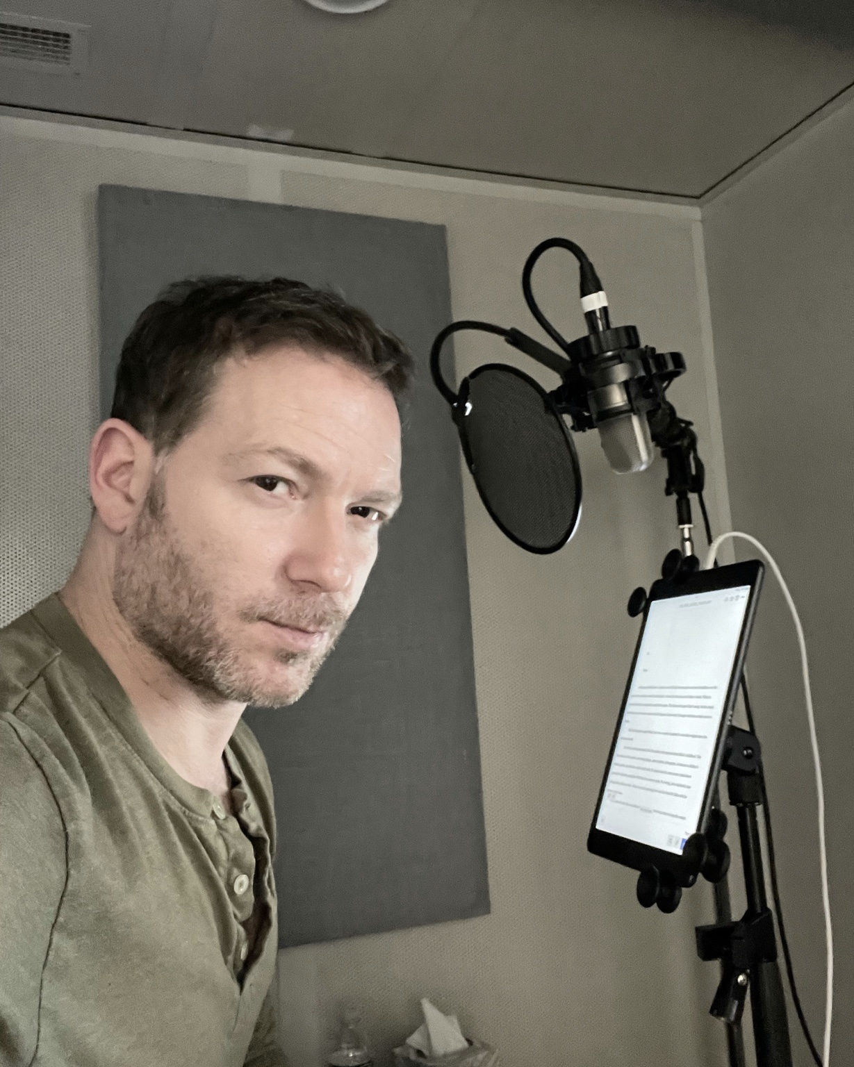 Ari Fliakos recording an audiobook